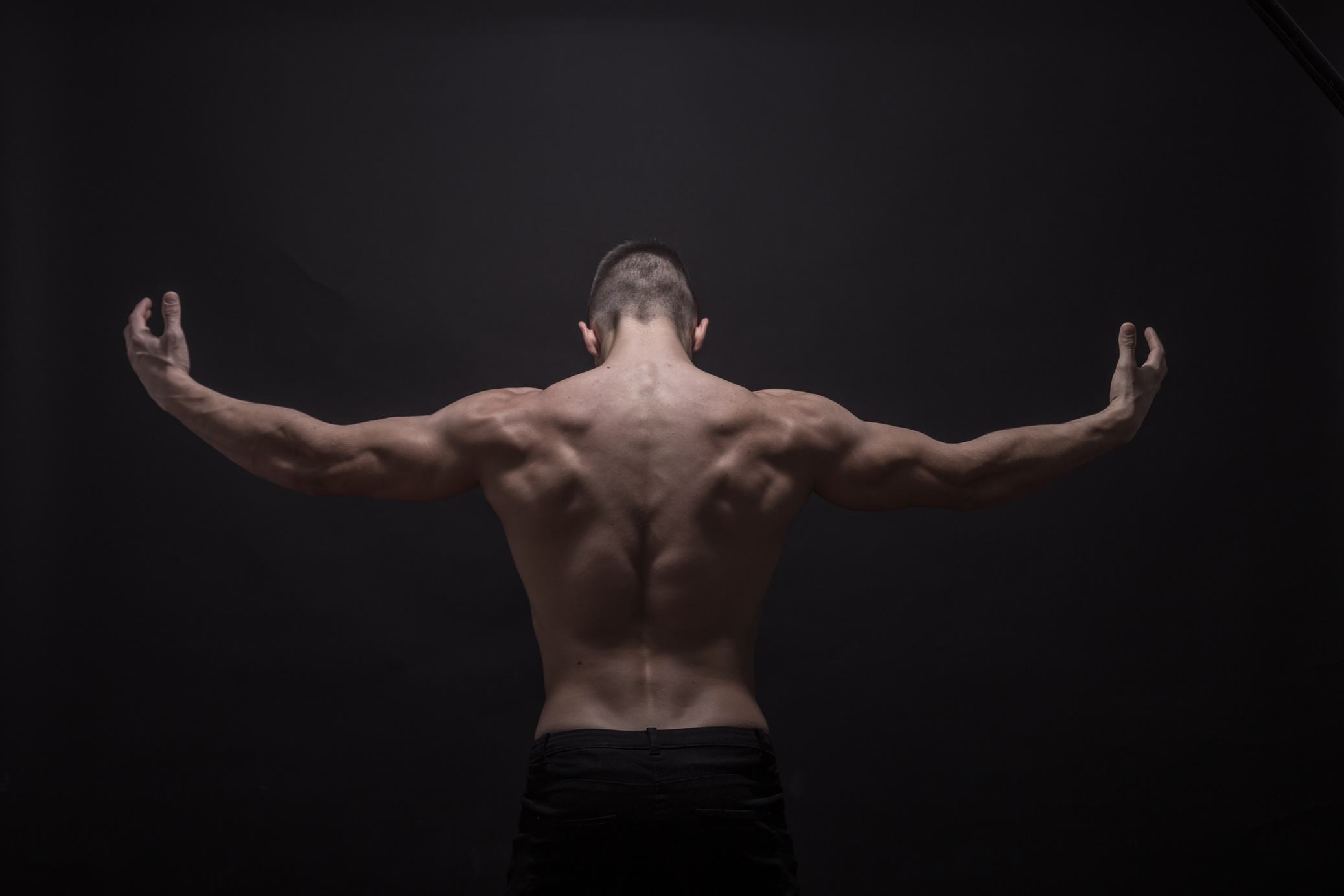 Young Man Posing Back Muscles